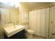 Clean bathroom features a modern vanity, new fixtures, and a shower with a curtain at 1211 Westview Ln # 201, Raleigh, NC 27605