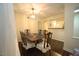 Formal dining area has chandelier, seating for six and is situated next to the kitchen at 1211 Westview Ln # 201, Raleigh, NC 27605
