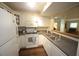 Updated kitchen with white cabinets and appliances with stainless steel sink and faucet at 1211 Westview Ln # 201, Raleigh, NC 27605