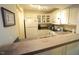Well-maintained kitchen boasts white cabinets, appliances, and eat-up bar area at 1211 Westview Ln # 201, Raleigh, NC 27605