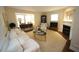 Inviting living room showcasing a fireplace, comfortable seating, and ample natural light at 1211 Westview Ln # 201, Raleigh, NC 27605