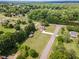 Sprawling aerial view of a well-maintained home and property with lush green lawn and mature trees at 123 Sanders Road Rd, Benson, NC 27504