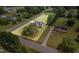 Aerial view of house with property lines showing mature trees, green lawn and surrounding street at 123 Sanders Road Rd, Benson, NC 27504