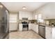 Well-lit kitchen with stainless steel appliances, granite countertops, and white cabinetry at 123 Sanders Road Rd, Benson, NC 27504
