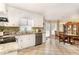 Bright kitchen with granite countertops, stainless steel dishwasher, and checkered tile floor at 123 Sanders Road Rd, Benson, NC 27504