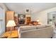 Cozy living room features a brick fireplace, plush seating, and hardwood floors at 123 Sanders Road Rd, Benson, NC 27504