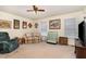 A living room featuring a ceiling fan, a window, and light carpet at 123 Sanders Road Rd, Benson, NC 27504