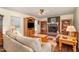 Comfortable living room with a fireplace, natural wood furniture, and a large TV at 123 Sanders Road Rd, Benson, NC 27504