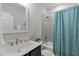 Bathroom with a combined shower and tub area, stylish vanity, toilet, and contemporary design at 15 Willow Bend Dr, Youngsville, NC 27596
