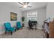 Comfortable bedroom setup with desk, gaming monitors, ceiling fan, and abundant natural light at 15 Willow Bend Dr, Youngsville, NC 27596