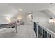 Bright bonus room featuring plush carpet, foosball table and comfortable seating area at 15 Willow Bend Dr, Youngsville, NC 27596
