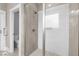 Modern bathroom with glass enclosed shower featuring tile walls and floor and contemporary fixtures at 15 Willow Bend Dr, Youngsville, NC 27596