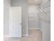 Walk-in closet with adjustable shelving and ample storage space at 1602 Red Roses Way, Durham, NC 27703