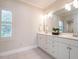 Bathroom features a double sink vanity, a window, and natural light at 1605 Park Dr, Raleigh, NC 27605