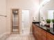 Elegant bathroom featuring granite counters, double vanity, and a glass-enclosed shower stall at 1605 Park Dr, Raleigh, NC 27605