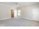 A carpeted bedroom features natural light, a fan, base trim and attached ensuite at 1605 Park Dr, Raleigh, NC 27605