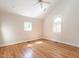 Bright bedroom with vaulted ceiling, recessed lights, hardwood flooring, and two windows at 1605 Park Dr, Raleigh, NC 27605