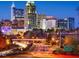 Striking nighttime view of the city skyline with illuminated buildings and flowing traffic at 1605 Park Dr, Raleigh, NC 27605