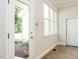 Inviting entryway with tile floor and a view to the landscaped front yard at 1605 Park Dr, Raleigh, NC 27605
