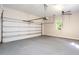 Spacious two-car garage with an automatic door opener and a window providing natural light at 1605 Park Dr, Raleigh, NC 27605