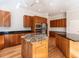 Spacious kitchen with wooden cabinets, dual islands, modern appliances, and hardwood floors at 1605 Park Dr, Raleigh, NC 27605