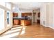 Bright, spacious kitchen with hardwood floors, stainless steel appliances, island and adjacent dining area at 1605 Park Dr, Raleigh, NC 27605