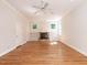 Bright living room features hardwood floors, fireplace, and custom built-in shelving units at 1605 Park Dr, Raleigh, NC 27605