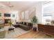 Spacious living room includes a decorative fireplace, built-in shelving, and hardwood floors at 1605 Park Dr, Raleigh, NC 27605