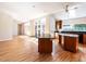 Spacious living room has hardwood floors and is adjacent to kitchen at 1605 Park Dr, Raleigh, NC 27605
