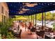 Picturesque outdoor patio seating under a covered awning, ideal for dining al fresco at a restaurant at 1605 Park Dr, Raleigh, NC 27605