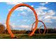 Unique outdoor sculpture on a green lawn against a backdrop of a blue sky with scattered clouds at 1605 Park Dr, Raleigh, NC 27605