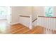 Beautiful staircase with wood railings and hardwood floors leading to the upper level at 1605 Park Dr, Raleigh, NC 27605