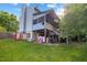 Spacious backyard featuring a deck, storage, and mature trees, perfect for outdoor entertaining at 1924 Strebor St, Durham, NC 27705