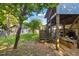 Backyard view features a deck, stairs, and spacious yard, perfect for outdoor gatherings and relaxation at 1924 Strebor St, Durham, NC 27705