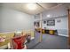 Finished basement with gray carpeting, half-wall trim, recessed lighting, and a built-in desk area at 1924 Strebor St, Durham, NC 27705