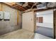 Unfinished basement has cement block walls, concrete floors, and carpeted area at 1924 Strebor St, Durham, NC 27705