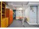 Basement with wood storage and a red chair at 1924 Strebor St, Durham, NC 27705