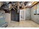 Unfinished basement with exposed utilities, concrete walls, and potential for a bathroom at 1924 Strebor St, Durham, NC 27705