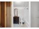 Picture shows a bathroom with a modern vanity, mirror, toilet, and a shower-tub combination at 1924 Strebor St, Durham, NC 27705