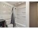 Picture shows a bathroom with a modern toilet, and a shower-tub combination with shelves at 1924 Strebor St, Durham, NC 27705
