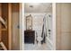 Picture shows a bathroom with a modern vanity, mirror, toilet, and a shower-tub combination with a shower curtain at 1924 Strebor St, Durham, NC 27705