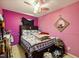 Pink bedroom with mirror at 1924 Strebor St, Durham, NC 27705