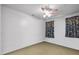 Empty bedroom featuring a fan and floral curtains at 1924 Strebor St, Durham, NC 27705