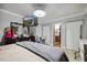 Bedroom with tv on the wall, ensuite bathroom access, and closet at 1924 Strebor St, Durham, NC 27705