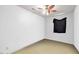Clean bedroom with a fan and small window at 1924 Strebor St, Durham, NC 27705