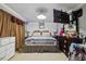 Bedroom with tv on the wall and furnished with a queen bed at 1924 Strebor St, Durham, NC 27705