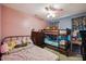 Cozy bedroom featuring a bunk bed, dresser, and floral-patterned decor at 1924 Strebor St, Durham, NC 27705