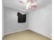 Simple bedroom with fan and window at 1924 Strebor St, Durham, NC 27705
