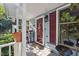 Cozy front porch with white railings, plants, and a welcome mat at 1924 Strebor St, Durham, NC 27705