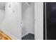 Hallway with a white wall leading to stairs at 1924 Strebor St, Durham, NC 27705